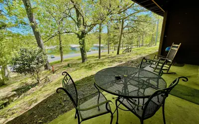 King Studio with king bed, dining area, sleeper sofa and view of Lake Ouachita by RedAwning